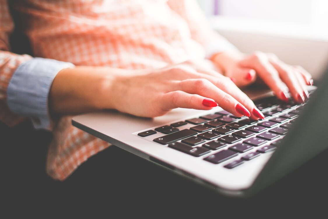 A person typing on a computerAI-generated content may be incorrect.